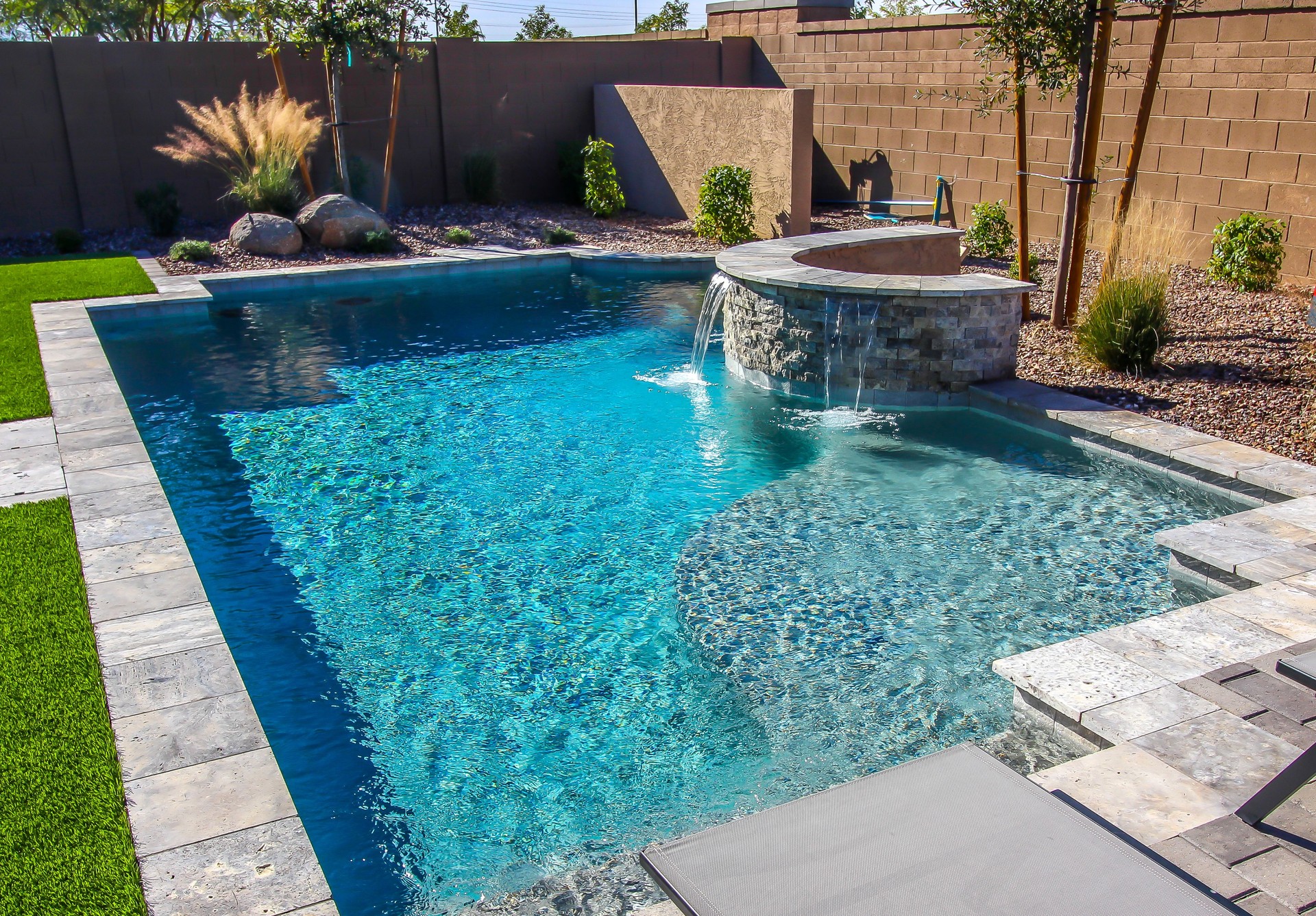 Rear Yard Swimming Pool With Waterfall
